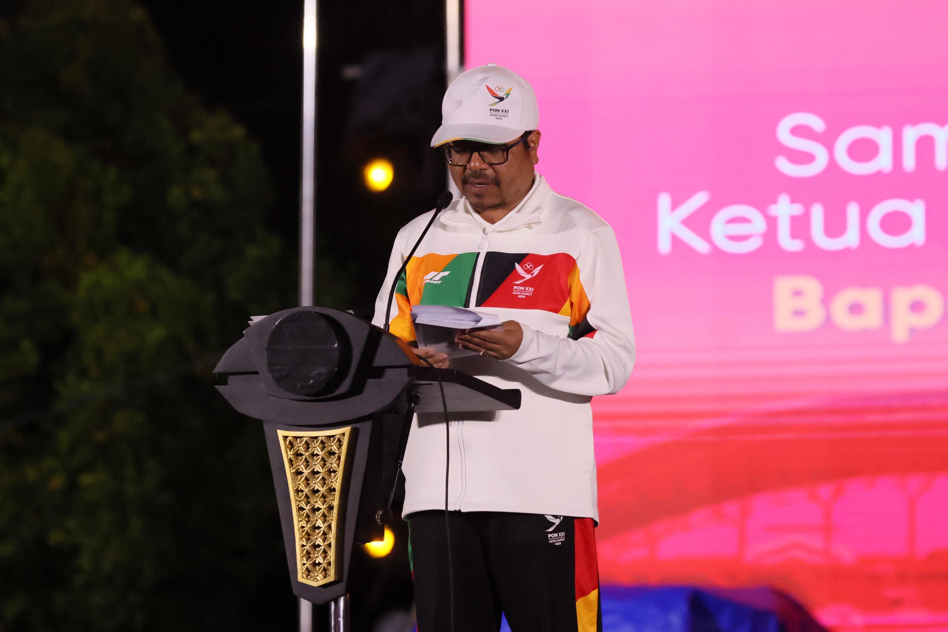 Ketua Harian PB PON Azwardi menyampaikan sambutan dan Pemadaman api PON serentak pada malam penutupan PON wilayah Aceh d SHB , Jum’at Malam , 20/9/2024.