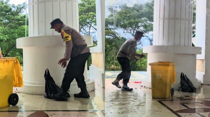 PUNGUT SAMPAH -- Sosok Aipda Antonius Solitar. Personel polisi ini membantu seorang petugas kebersihan memungut sampah-sampah yang ditinggalkan para pedemo di kantor DPRD Provinsi Gorontalo, Selasa (3/6/2025).