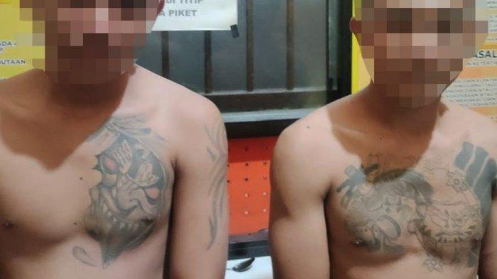 TAMPANG PREMAN - Dua preman bertato, unjuk jago aniaya warga di Kampung Bugis Gorontalo.