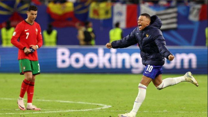 Beda ekspresi Cristiano Ronaldo dan Kylian Mbappe.