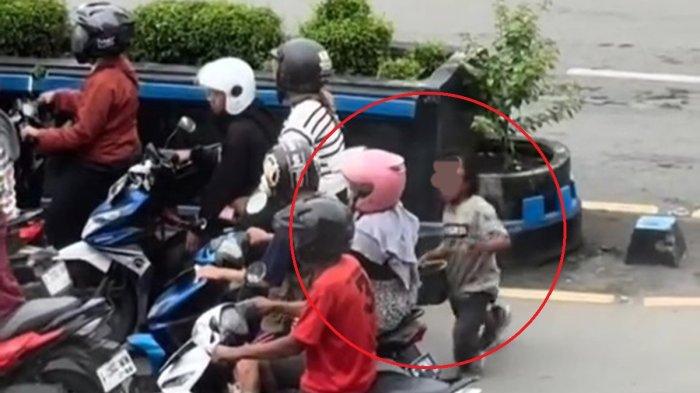 Potongan video seorang pengemis yang akan menyundutkan rokok kepada pengendara sepeda motor di Persimpangan Gili Tugel Kota Tegal, Senin (30/12/2024), sekira pukul 17.00 WIB.