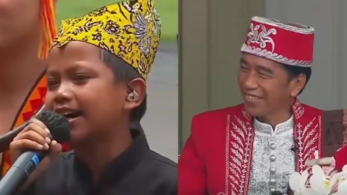 Presiden Joko Widodo tersenyum saat anak asal Banyuwangi, Farel Prayoga, menyanyi membawakan lagu