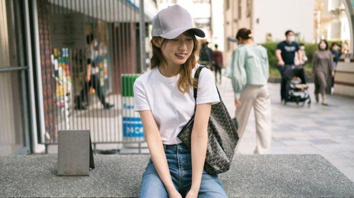 Medium shot japanese woman wearing trucker hat