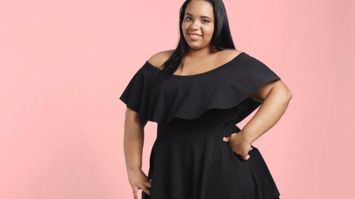Plus size model in studio shoot happy smiling