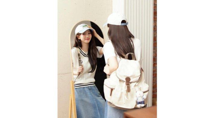 Karina aespa dengan OOTD vest dan jeans