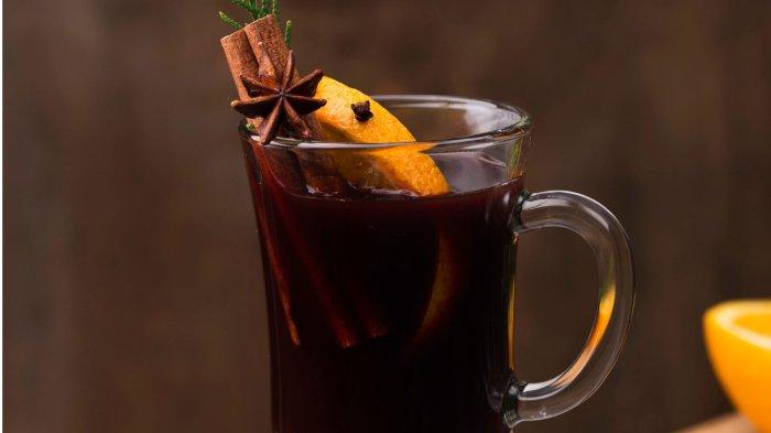 Cup of tea with lemon and cinnamon on table