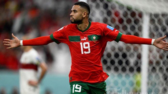 Penyerang Timnas Maroko, #19 Youssef En-Nesyri melakukan selebrasi usai mencetak gol pertama timnya dalam laga sepak bola perempat final Piala Dunia Qatar 2022 antara Maroko melawan Portugal di Stadion Al-Thumama, di Doha, Qatar, Sabtu (10/12/2022) waktu setempat. AFP/PATRICIA DE MELO MOREIRA