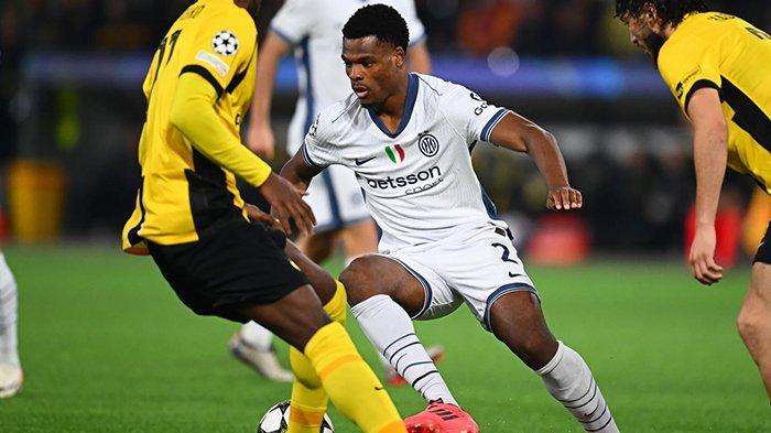 CURI PERHATIAN - Wingback Inter Milan, Denzel Dumfries berupaya melewati penjagaan pemain Young Boys, pada matchday 3 Liga Champions, di Stadion Wankdorf, Swiss, (Kamis (24/10/2024). Pemain asal Belanda itu tampil mencuri perhatian pada leg pertama semifinal Liga Champions melawan Barcelona di Estadi Olimpic Lluis Companys, Kamis (1/5/2025).