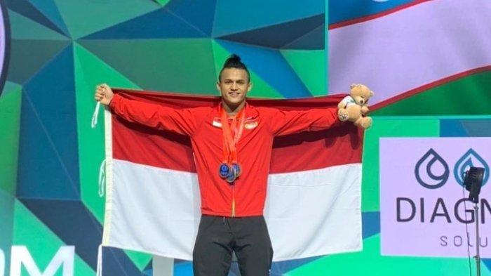 Atlet Angkat Besi Rizki Juniansyah peraih medali emas Olimpiade Paris 2024. Rizki Juniansyah turun di cabang olahraga angkat besi nomor 73 kg putra.
