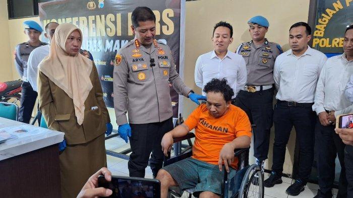RUDAPAKSA - Khalil Gibran (34) mengenakan kaos oranye tersangka penyekapan dan rudapaksa anak saat dihadirkan di Mapolrestabes Makassar, Jl Ahmad Yani, Kecamatan Wajo, Makassar, Senin (14/4/2025). Pelaku sempat ditembak saat akan ditangkap.
