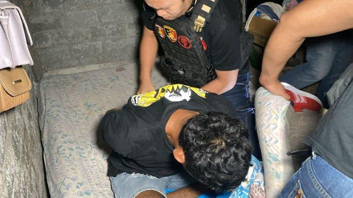 KDRT: Pelaku KDRT saat diamankan Polisi. Kasat Reskrim Polres Bitung, IPTU Gede Indra Astiangga Pratama mengungkap awal kejadian terjadi.