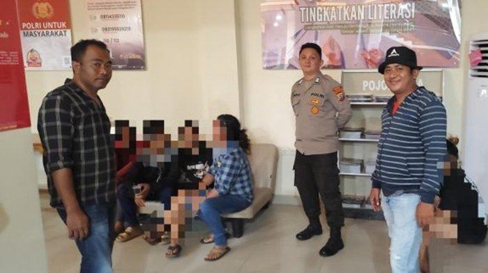 DIAMANKAN - Pelaku dan korban dugaan TPPO saat diamankan di Polsek Malalayang, Manado.