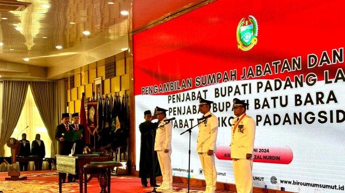 Penjabat (Pj) Gubernur Sumatera Utara, Hassanudin melantik tiga Pj Kepala Daerah di Aula Tengku Rizal Nurdin, di Jalan Jendral Sudirman, Kota Medan, Rabu (19/6/2024).
