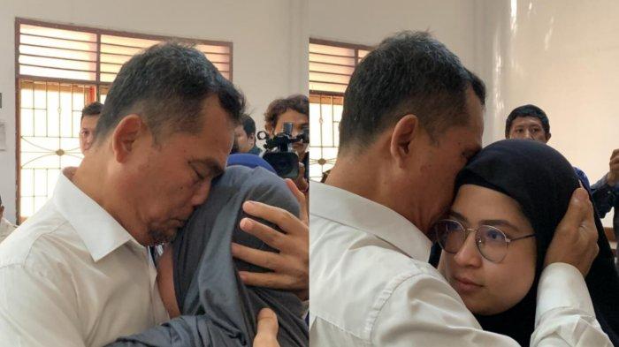 Terdakwa Alwi Mujahit Hasibuan, memeluk anaknya usai dituntut 20 tahun penjara dalam kasus proyek pengadaan Alat Pelindung Diri (APD) Covid-19 tahun 2020, Kamis (1/8/2024).