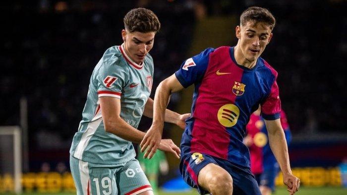 Editor: Muhammad Nursina Rasyidin
zoom-inlihat fotoAtletico Madrid vs Barcelona: Blaugrana Dominan di Metropolitano, Hansi Flick Optimistis Menang
Instagram Barcelona
ATLETICO VS BARCELONA - Pemain Barcelona Pedri berduel dengan pemain Atletico Madrid Julian Alvarez dalam pertandingan pekan ke-17 Laliga Spanyol 2024/2025.