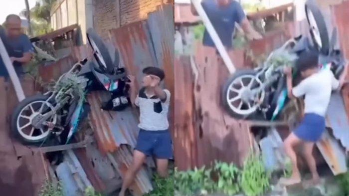Tengah viral dimedia sosial yang memperlihatkan sebuah motor tersangkut di pembatas jalan lahan kosong.