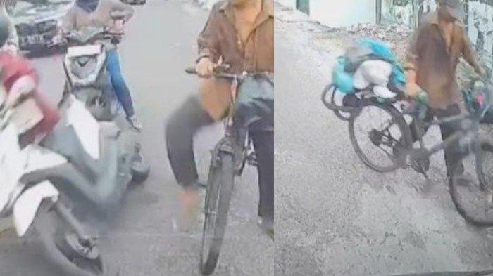 pria pesepeda yang menendang wanita pengendara motor hingga terjungkal di jalan