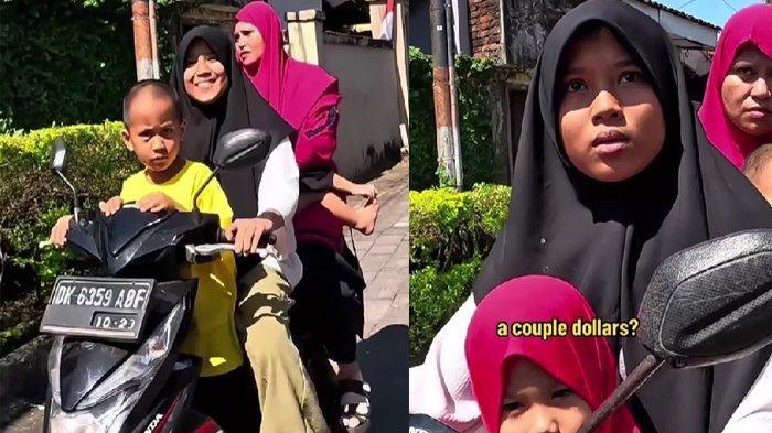 Gadis Bali berhijab hitam membantu turis asing yang dompetnya ketinggalan