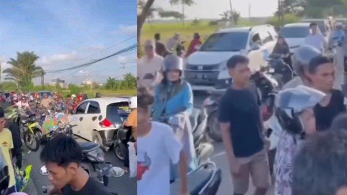Kondisi jalan macet banyak warga yang pensaran melihat motor tersangkut di seng