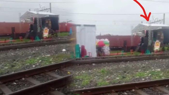 Panggung hajatan berdiri di tengah rel kereta api