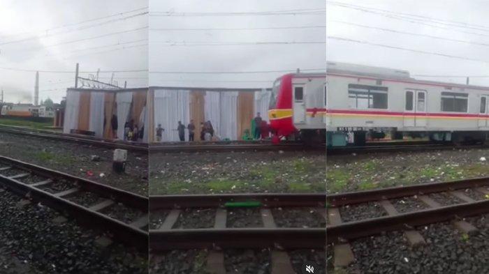Tenda hajatan berdiri di tengah rel kereta api lengkap dengan panggung dangdutan