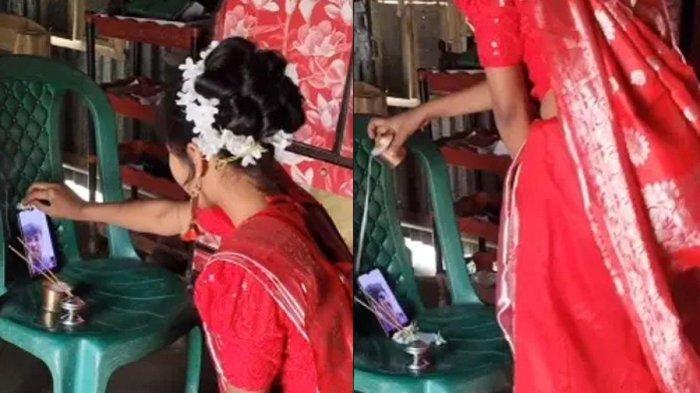 Wanita melakukan ritual sambil menatap layar ponsel 2
