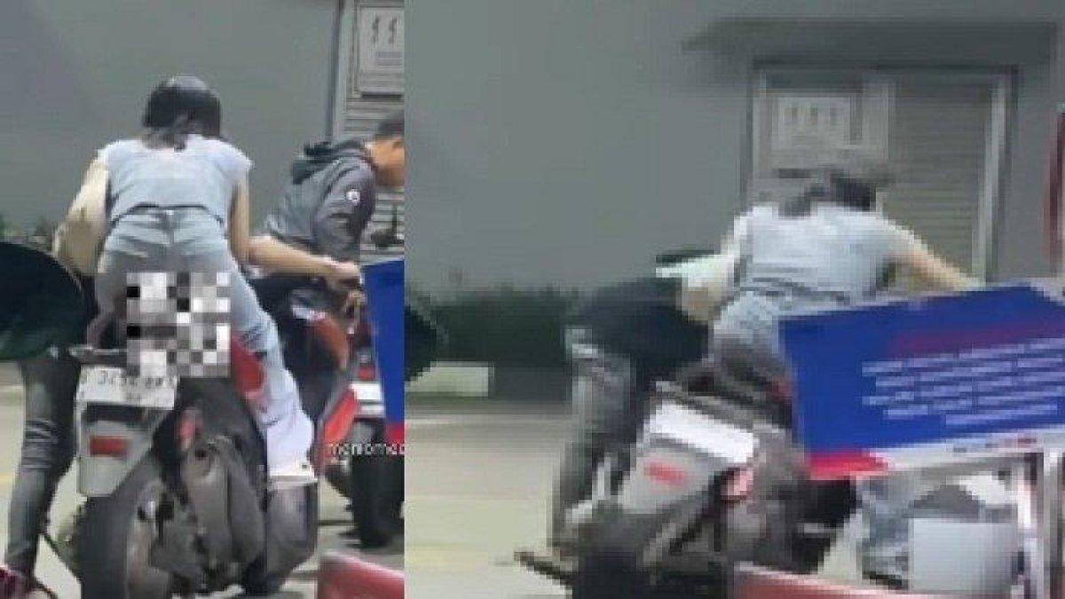 seorang wanita tak turun dari motor saat isi bensin di SPBU.