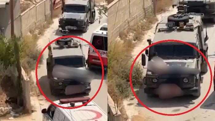 Seorang warga Palestina yang terluka diikat di atas kap mobil militer Israel