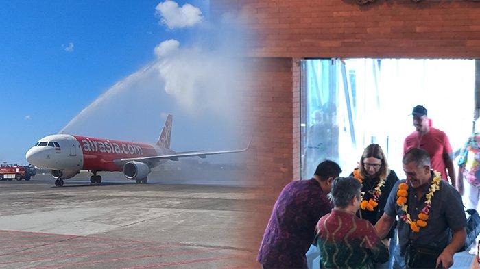 Water salute sambut kedatangan perdana maskapai Indonesia AirAsia penerbangan dari Cairns saat tiba di Bandara I Gusti Ngurah Rai.