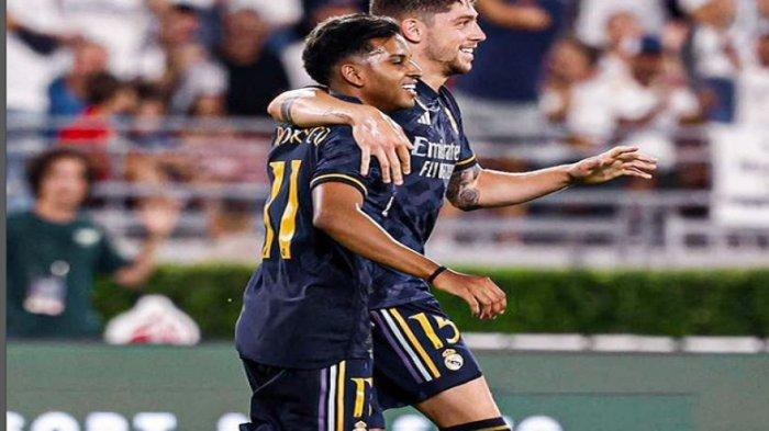 Pemain Real Madrid Rodrygo dan Valvrede selebrasi usai mencetak gol. Prediksi skor Real Madrid vs Manchester United di laga ujicoba, head to head dan link live streaming.