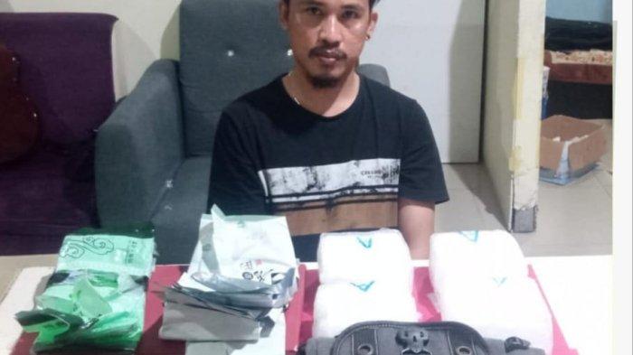 Pelaku tindak peredaran narkotika seberat 4 kilogram Edi Jahri saat diamankan Polresta Pangkalpinang.