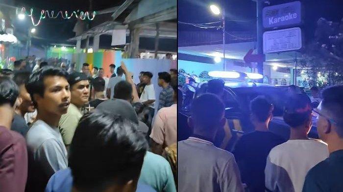 Warga yang berdatangan ke lokasi tempat karaoke di Rohil pasca insiden penikaman yang menewaskan dua orang dan satu kritis. Salah satu korban meninggal anggota polisi Polsek Sinaboi.