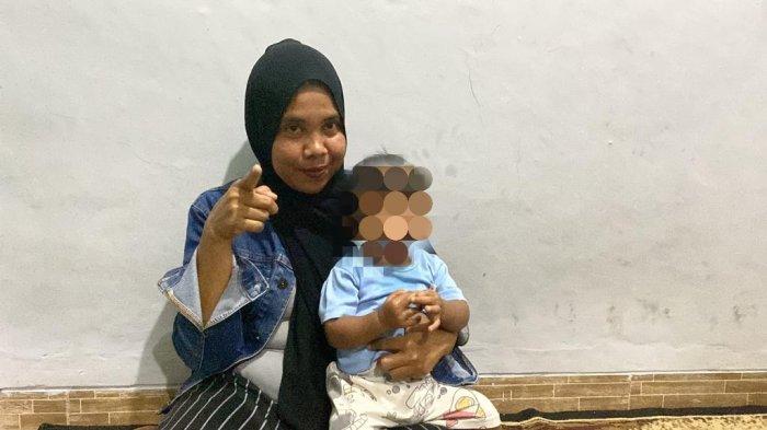 Siti Mauliah (37) seorang ibu asal Ciseeng, Kabupaten Bogor, menceritakan perjuangan saat mengandung bayi tertukar yang tak mudah, Kamis (10/8/2023).