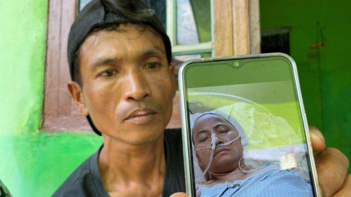 TKW SAKIT PARAH - Mujahid, saat menunjukkan kondisi terkini istrinya yang sedang dirawat di rumah sakit di Taiwan, Rabu (28/5/2025).