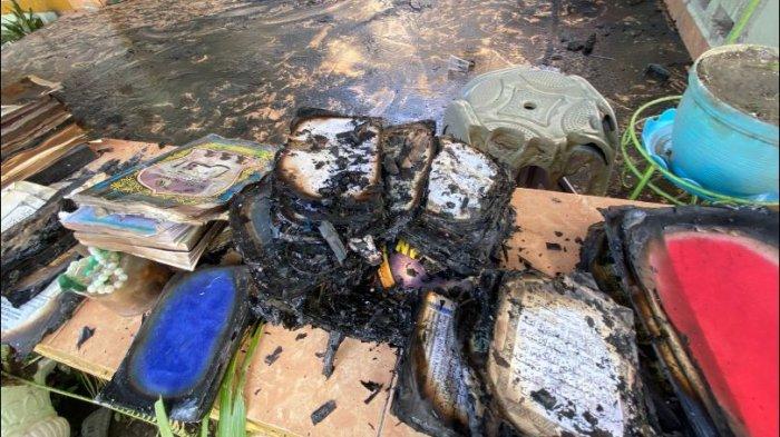 Potret alquran hangus terbakar