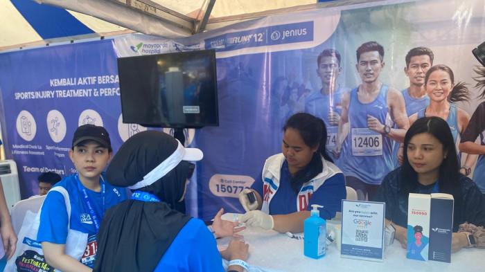 BOOTH MAYAPADA - Booth Mayapada Hospital Bandung dalam acara Pocari Sweat Run 2025, yang digelar di Balai Kota Bandung pada Sabtu (19/7/2025).