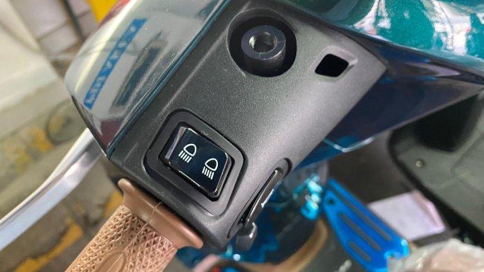 Tombol pengatur lampu sepeda motor