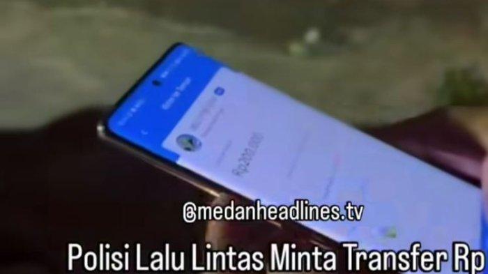 Aksi personel Unit Lantas Polsek Medan Baru, Bripka HS, yang meminta uang denda tilang Rp200 ke warga, viral di media sosial
