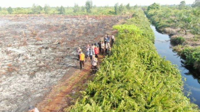 Ditreskrimsus Polda Jambi, Polres Muaro Jambi, BPBD Kabupaten Muaro Jambi, Babinsa Koramil, dan Kelompok Masyarakat Peduli Api pengecekan hotspot di perbatasan Provinsi Jambi - Sumatera Selatan pada Selasa (23/7/2024)