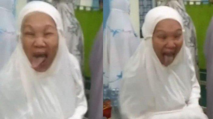 Wanita Aneh Menjulurkan Lidah di Masjid
