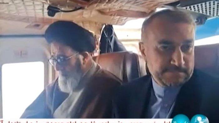 Presiden Iran Ebrahim Raisi (kiri) dan Menteri Luar Negeri iran Hossein Amir-Abdollahian (kanan) sebelum tewas dalam kecelakaan helikopter di hutan Dizmar antara Kota Varzaqan dan Jolfa di Provinsi Azerbaijan Timur, dekat perbatasan Iran dengan Azerbaijan, Minggu (19/5/2024).(IRINN via THE GUARDIAN)