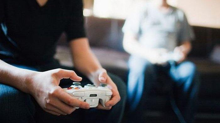 ILUSTRASI pria muda asyik bermain game online.