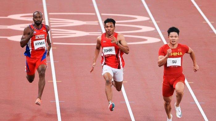 Sprinter Indonesia, Lalu Muhammad Zohri (tengah), saat tampil pada babak utama 100m putra cabang olahraga atletik, di Olympic Stadium, Tokyo, Sabtu (31/7/2021).