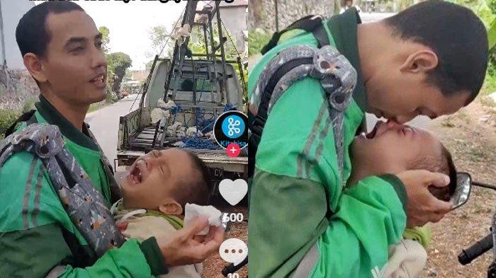 Driver ojol yang gendong anak difabel sambil bekerja cari orderan.