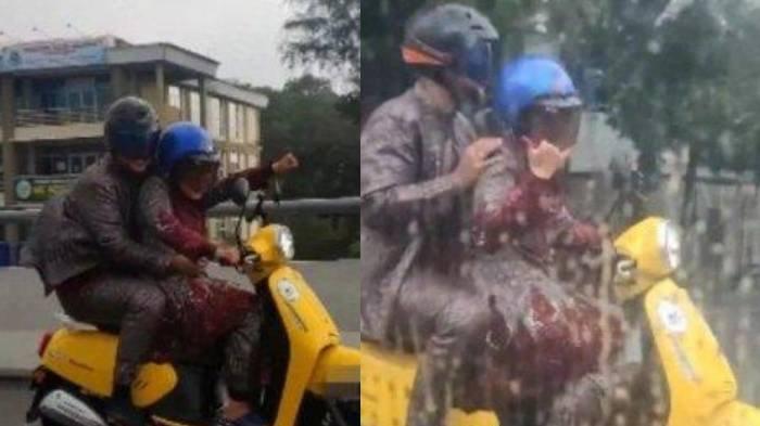Sebuah video sepasang pengantin menaiki motor hujan-hujanan, viral di media sosial.