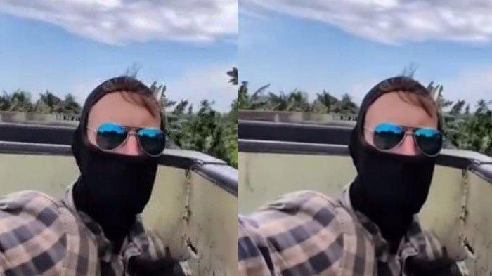 TINGKAH BULE - Tangkapan layar YouTuber asal Rusia bernama Vaga Vagabond membuat geger warganet setelah mengunggah vlognya naik kereta api batu bara di Sumatera, Jumat (11/4/2025). KAI memberikan respon.