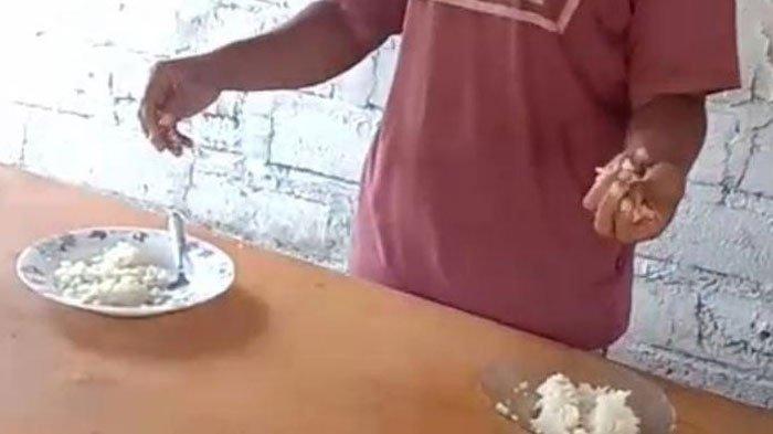 Video perempuan bernama Regina Iralolon (26) warga Desa Bour, Kabupaten Lembata, NTT, sedang membandingkan nasi dari beras asli dan palsu