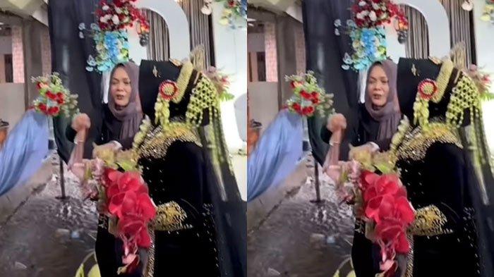 LEMPAR CELANA - Tangkapan layar video viral pengantin wanita lempar celana dalam ke atap rumah untuk menghentikan hujan, Rabu (19/2/2025). Sosiolog menyebut hal tersebut merupakan tradisi.