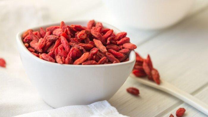 Goji in bowl on wood table