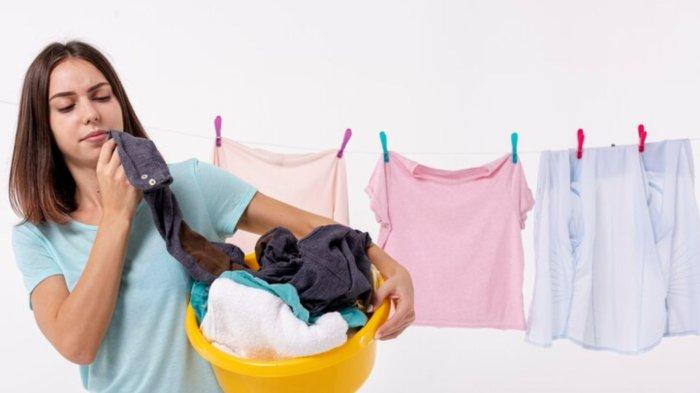 Front view woman holding a yellow laundry basket